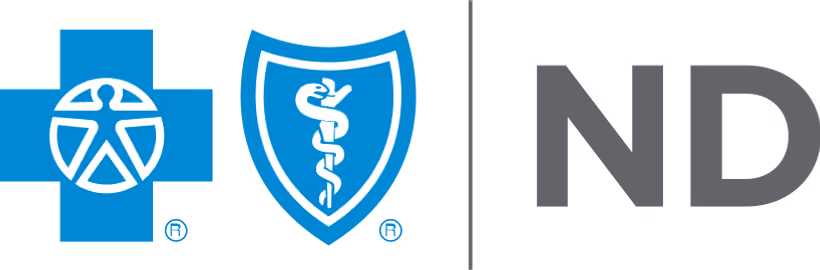 Blue cross symbol with a stylized person in a circle next to a blue shield with a caduceus snake and staff emblem followed by the letters 'ND' in gray.