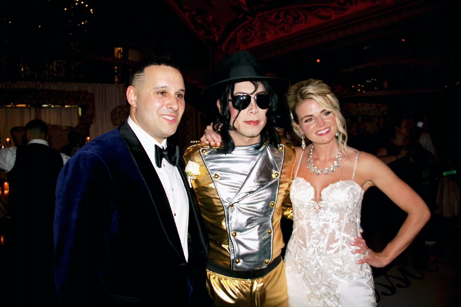 Maxx Vega Michael Jackson impersonator with bride and groom at wedding reception private event