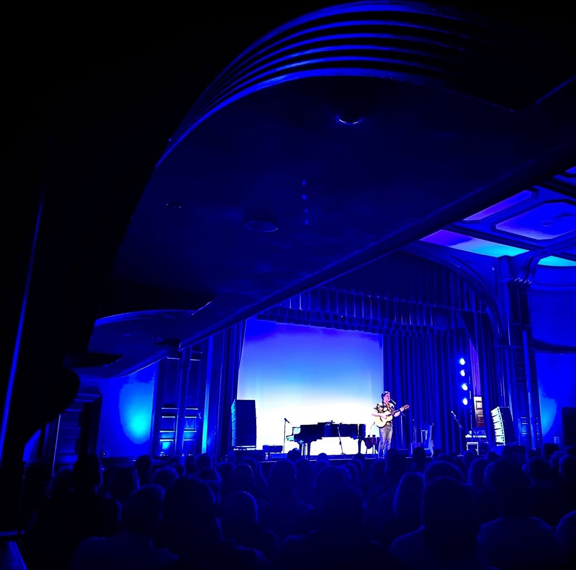 Payomet Center for the Performing Arts beautifully lit, a piano waits on stage to be played for the concert.