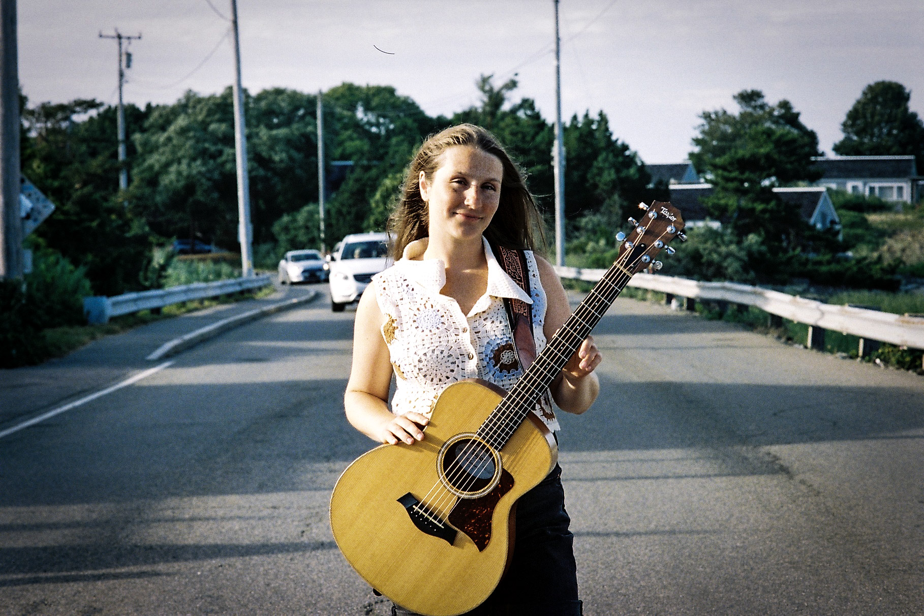 Natalia Bonfini and her guitar stopping traffic in Wellfleet.