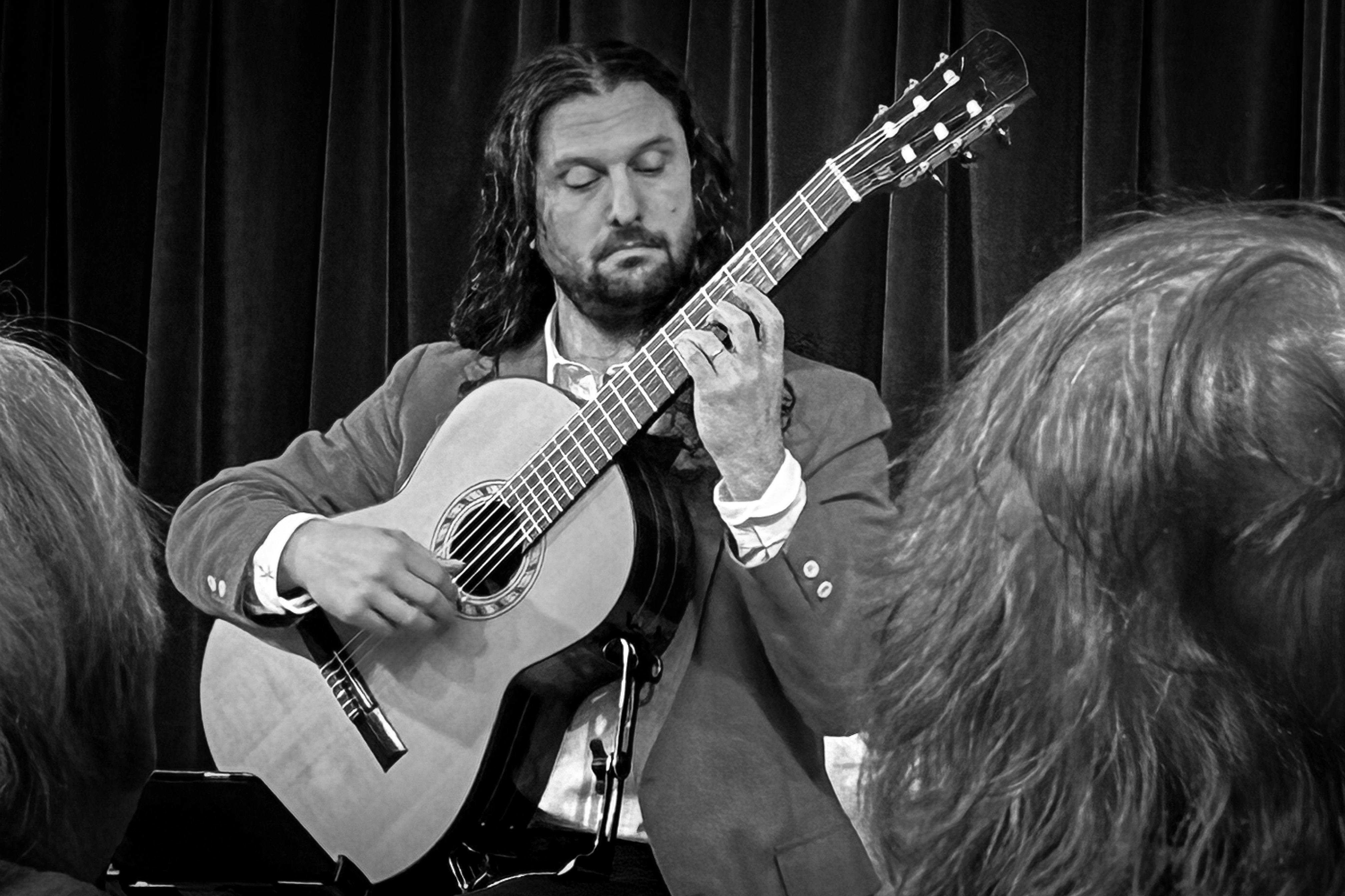 Aaron Larget-Caplan performs his classical guitar show Guitar America 250: Revolutionaries & Rockstars at the Wellfleet Pereservation Hall in April 2026.