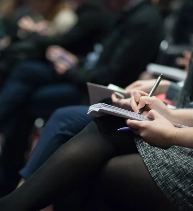 a woman is taking notes