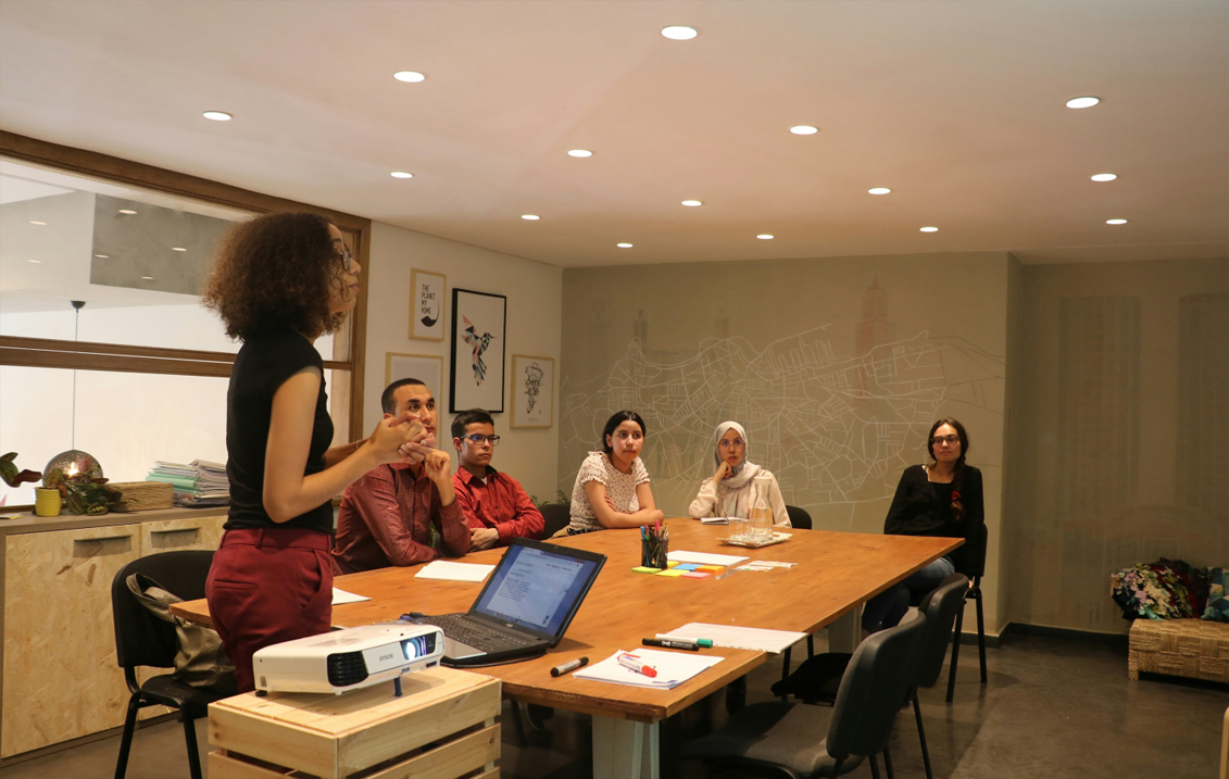 Business professional presenting project solutions to a team, illustrating Catalect's expertise in managing and delivering successful projects