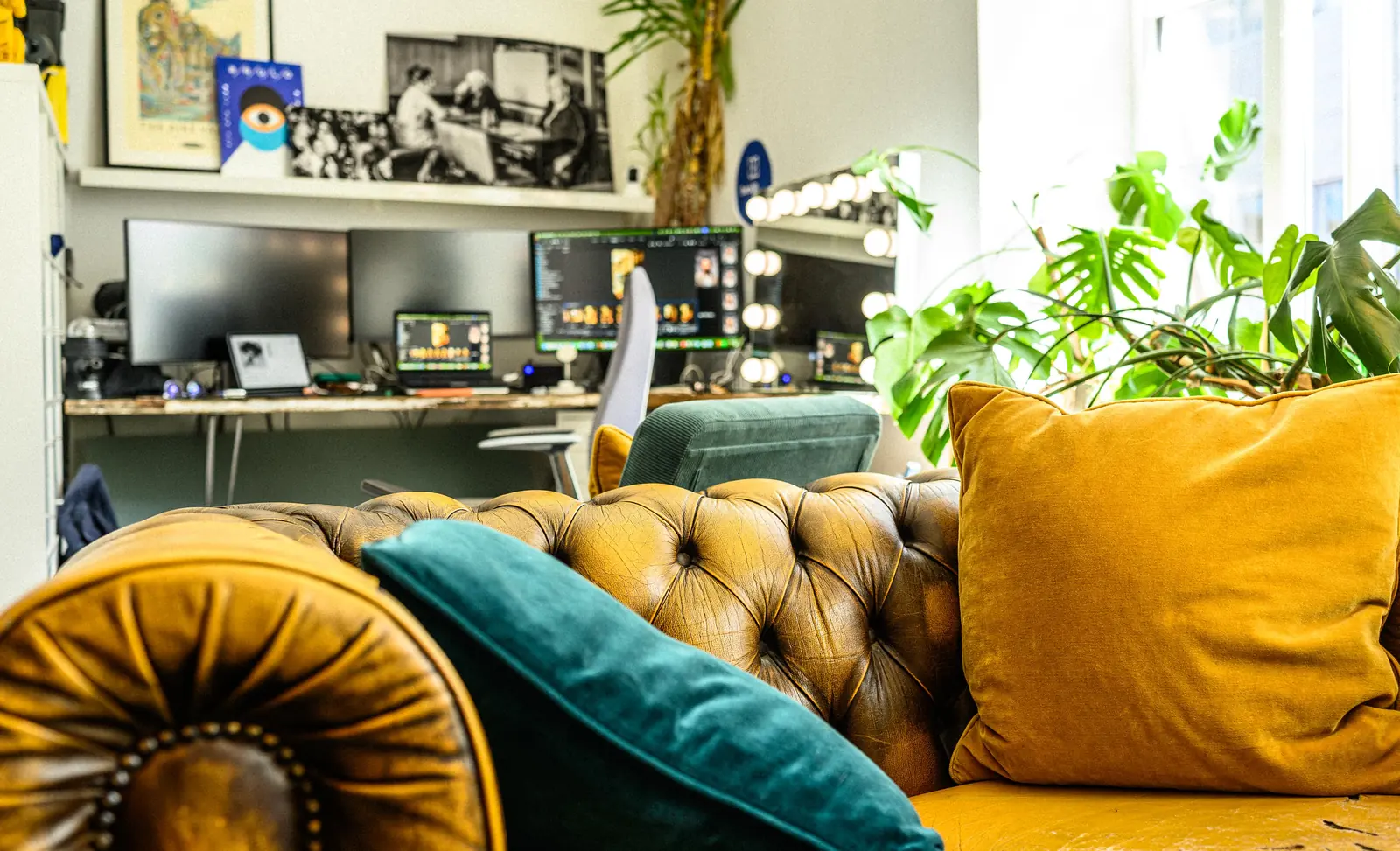 Edit suite and lit makeup mirror behind the Chesterfield seating at Dock Street Studio Leeds