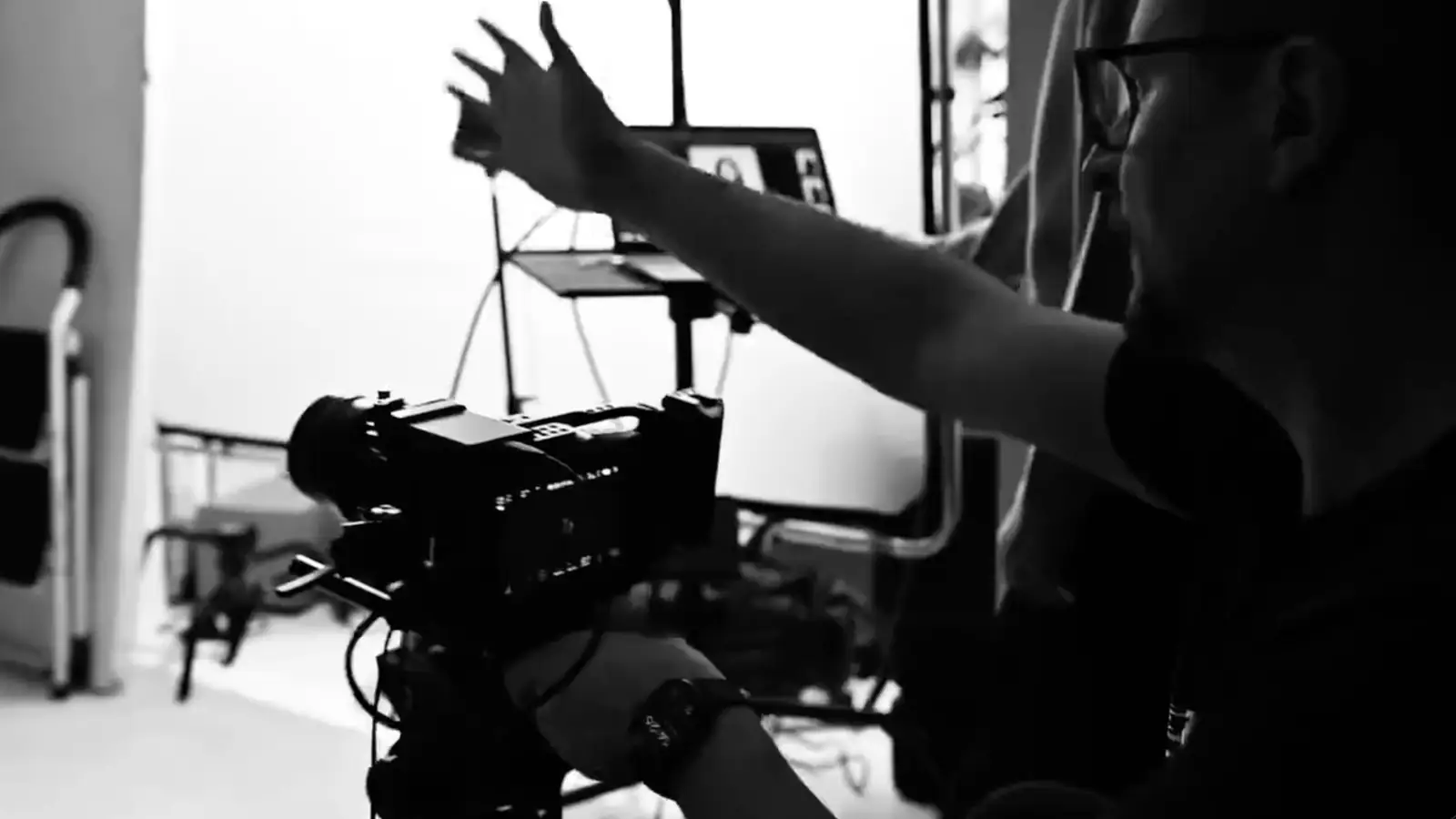 Mark Wheelwright directing on set at Dock Street Studio, black and white