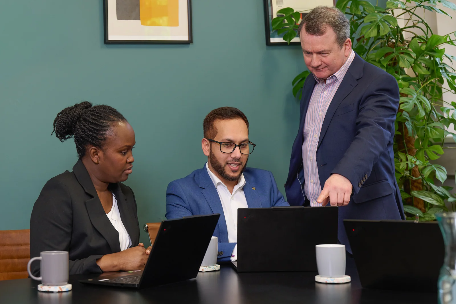 Commercial team headshots and branding photography for Paystrax in Leeds