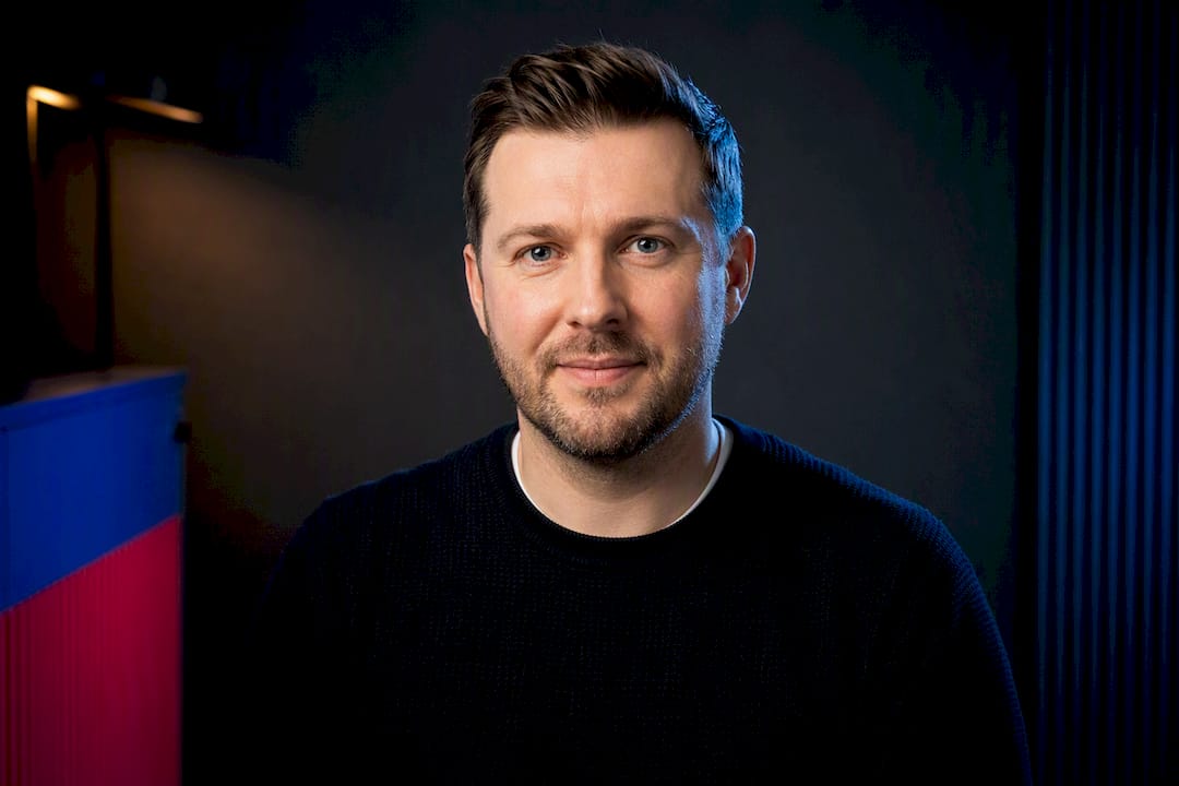 Professional headshot framed for circular crop