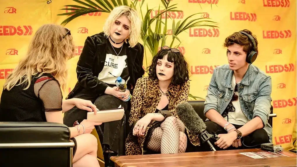 Press interview against a branded backdrop at Leeds Festival, photographed by Dock Street Studio