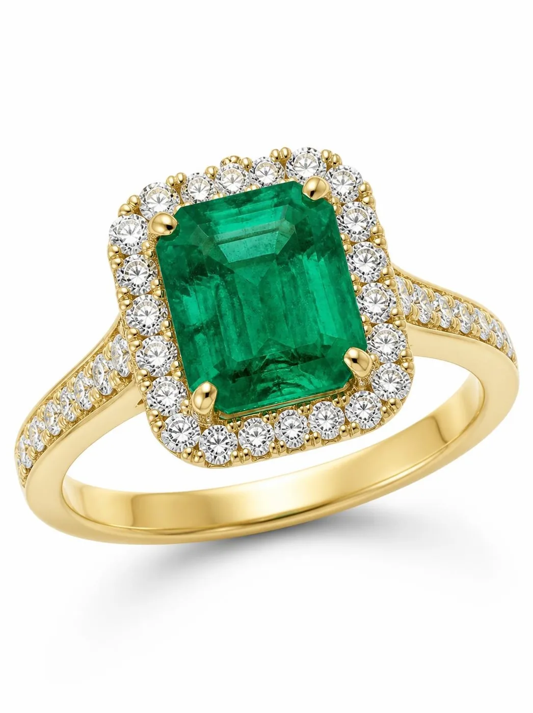 Emerald and diamond halo ring in yellow gold on a white sweep, lit with a single large softbox to show smooth gradient reflections on the polished band