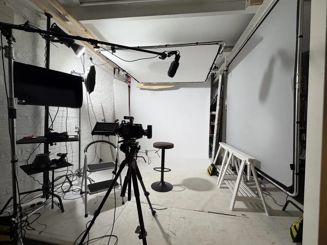 Dock Street Studio shooting space in Leeds with softbox, boom-mounted light, camera on tripod and white cove set for a product shoot