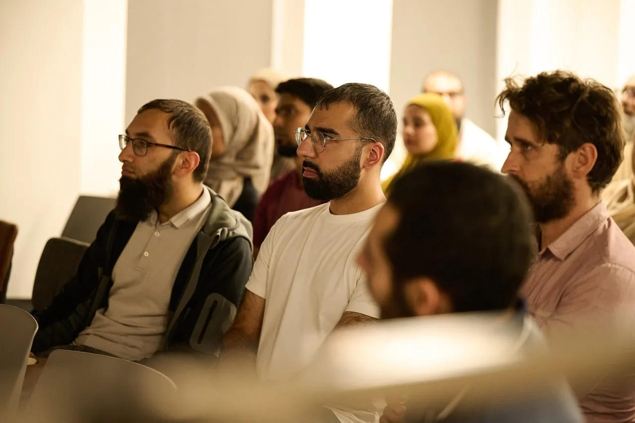 Audience smiling during Banking On Belief, hosted by Enablis with Digital Muslims North for Leeds Digital Festival in Leeds — event photography by Dock Street Studio, Leeds