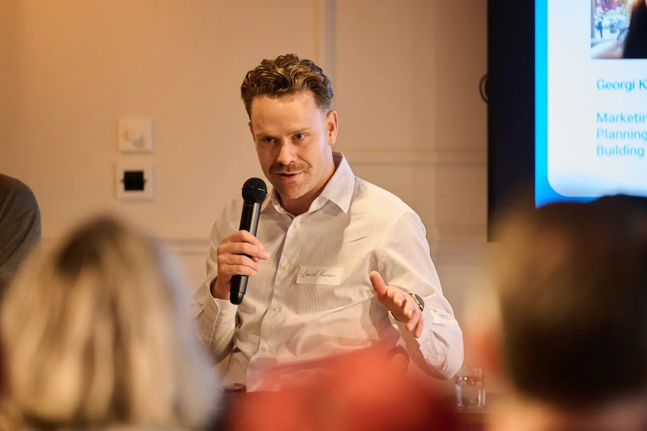Panellist speaking into a microphone at Transformation & Customer Outcomes, hosted by Skipton Group for Leeds Digital Festival — event photography by Dock Street Studio, Leeds