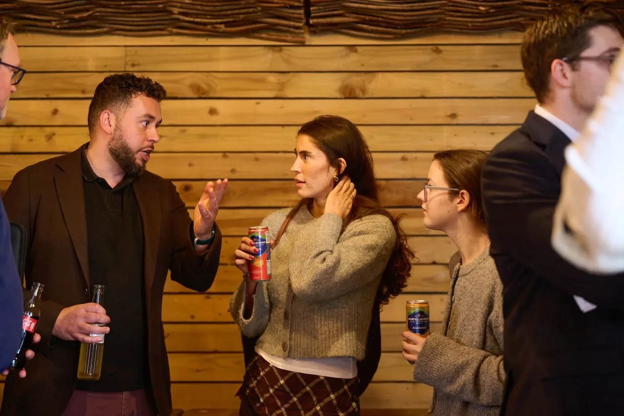 Three founders in conversation against a timber wall at Raising Early Stage Investment, hosted by HSBC Innovation Banking for Leeds Digital Festival — event photography by Dock Street Studio, Leeds