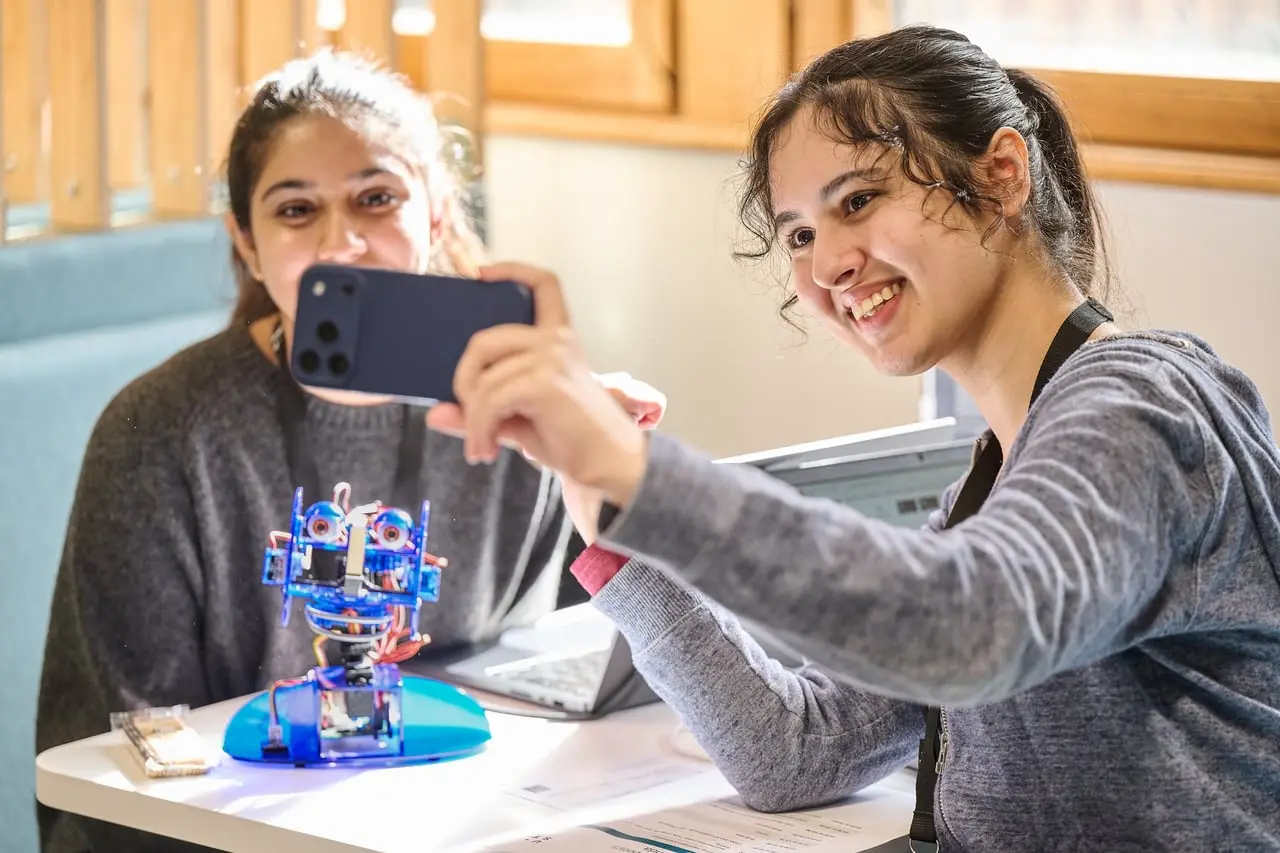 Students building and testing robots at the AI Agents and Robotics Student Hackathon, hosted by UST for Leeds Digital Festival — event photography by Dock Street Studio, Leeds