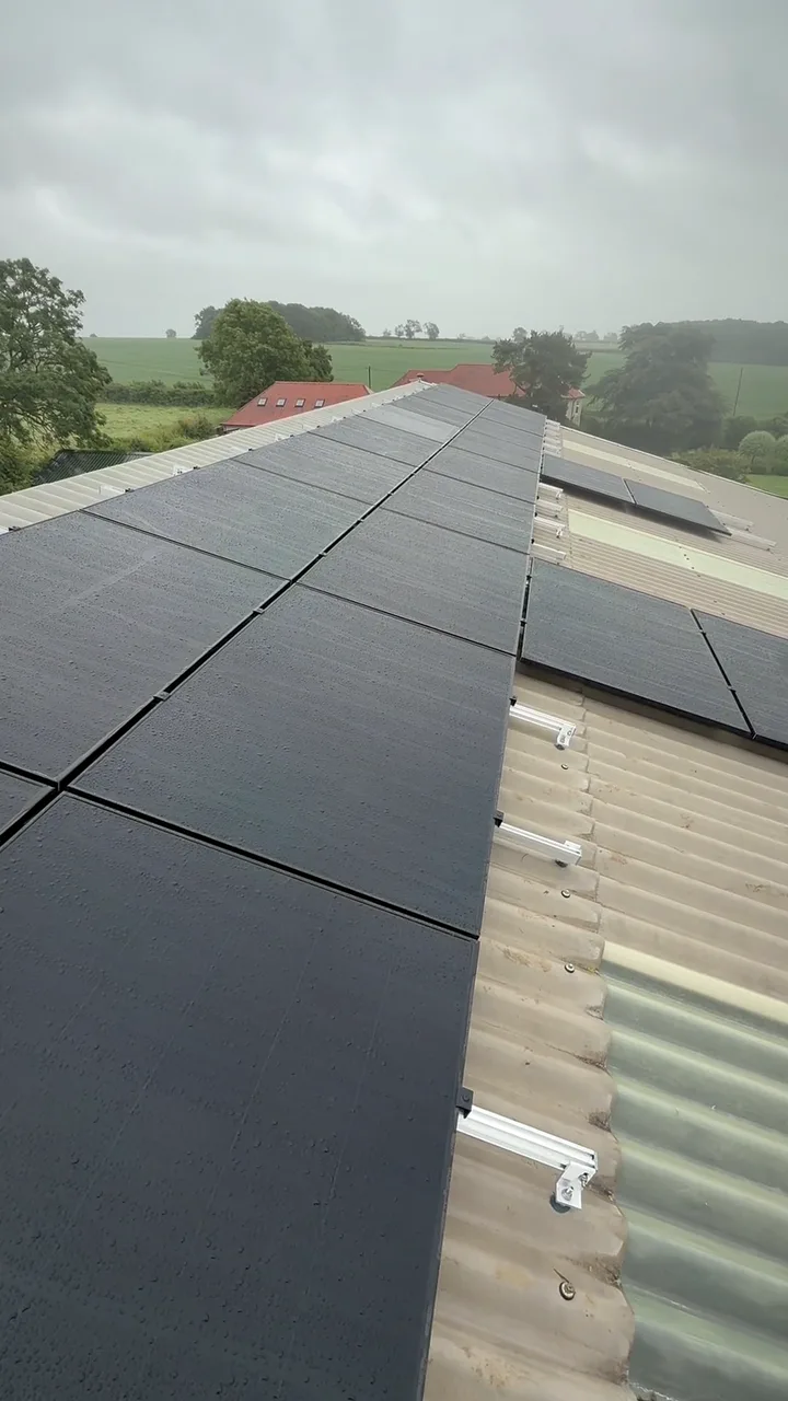 All-black solar panels across a barn roof near Melton Mowbray, fitted with a Sigenergy battery and backup gateway