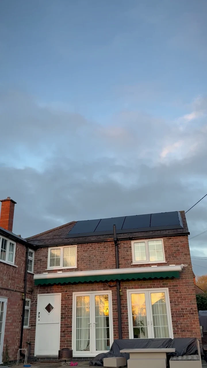 All-black solar panels on a village home in Barsby at sunset, with a Sigenergy battery and backup gateway inside