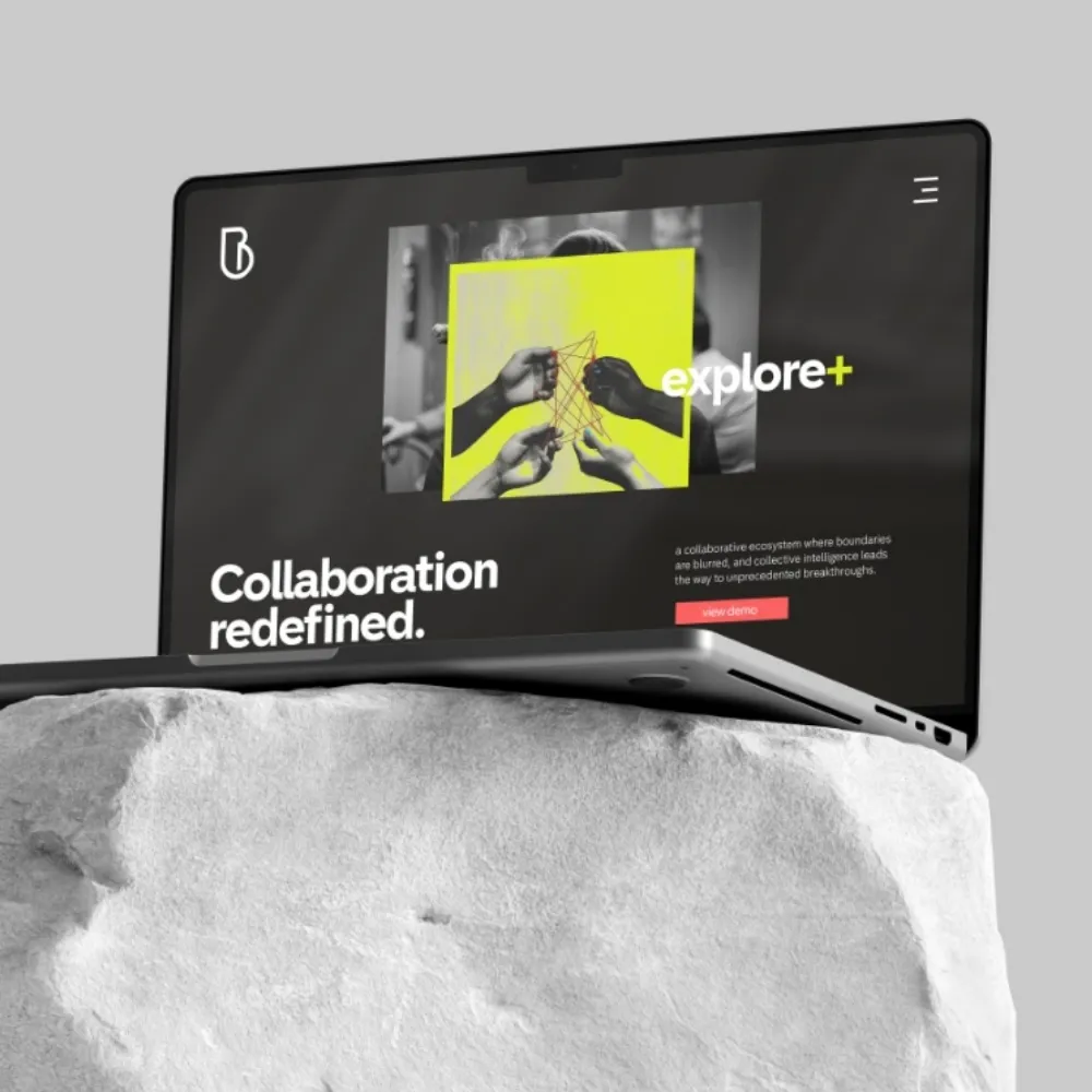 A laptop with a website that says explore+.
