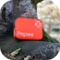 closed prepare medical carrying case on tree root