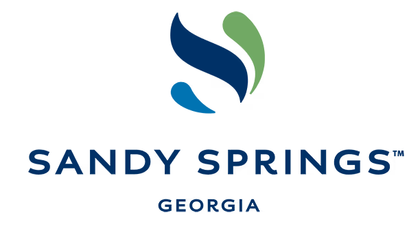 Sandy Springs logo with stylized green and blue leaves above the city name in navy blue text.