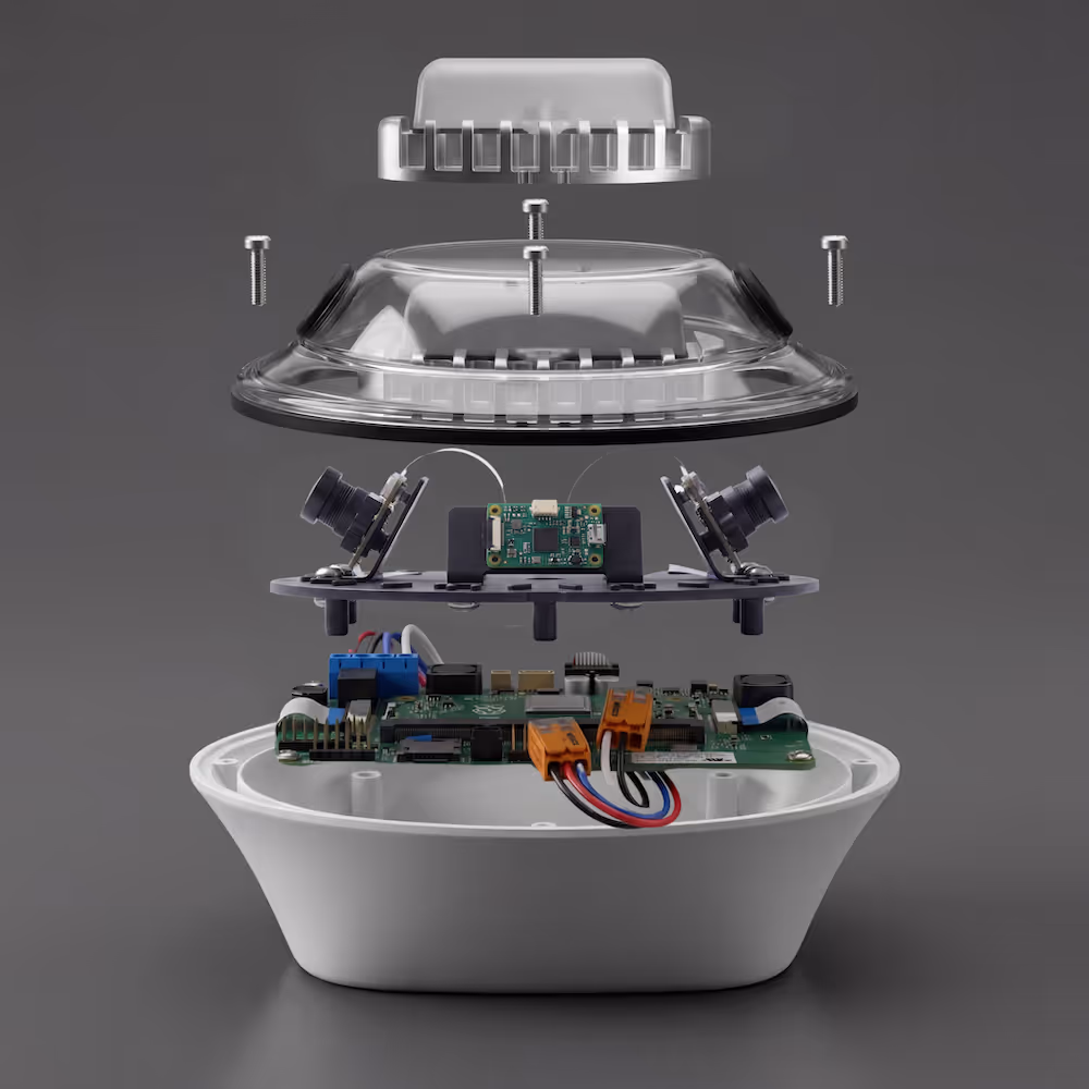 Exploded view of an electronic device showing circuit boards, cameras, screws, and plastic casing layers.