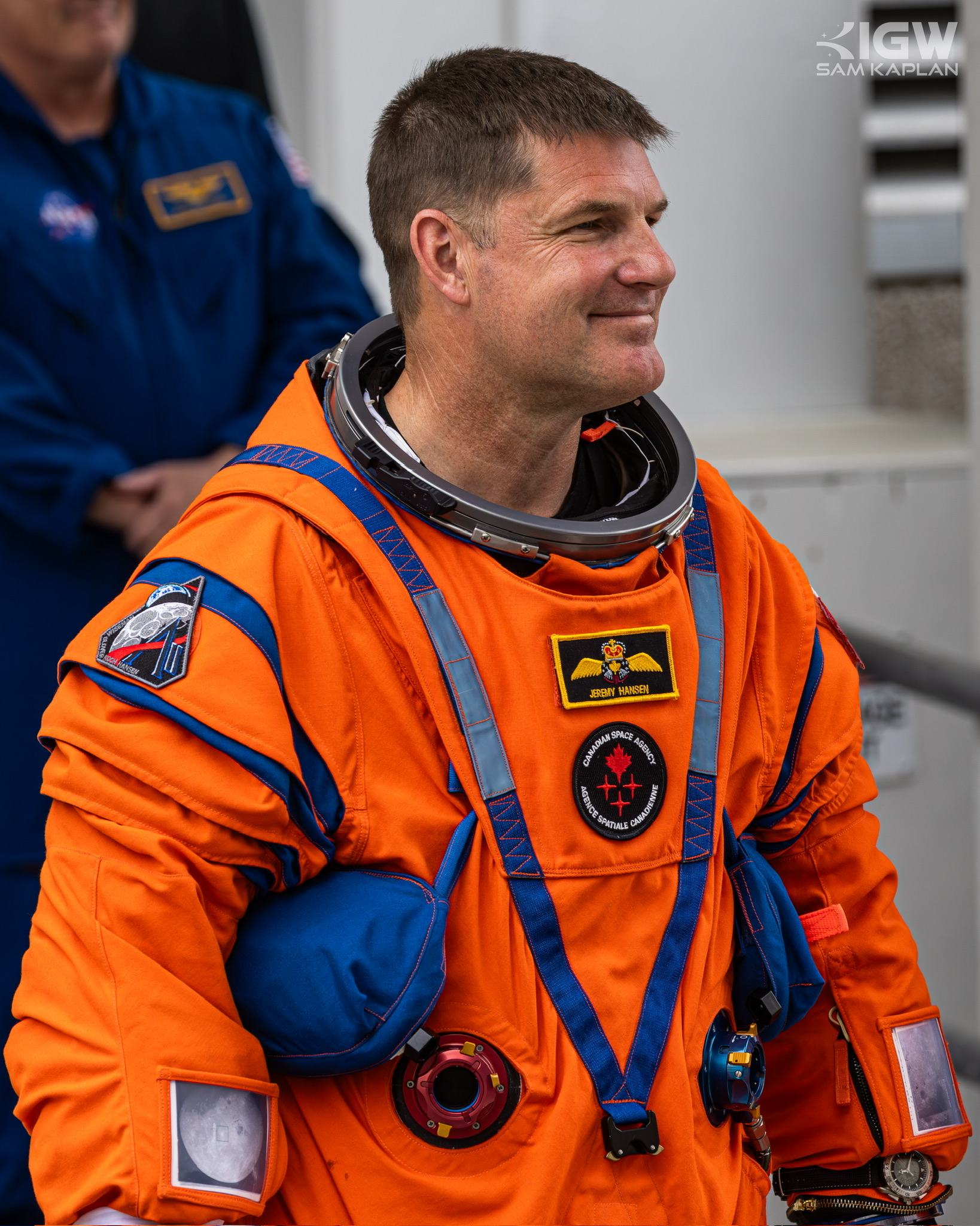 Jeremy Hansen in the orange launch and entry suit, the Canadian Space Agency patch on his chest.