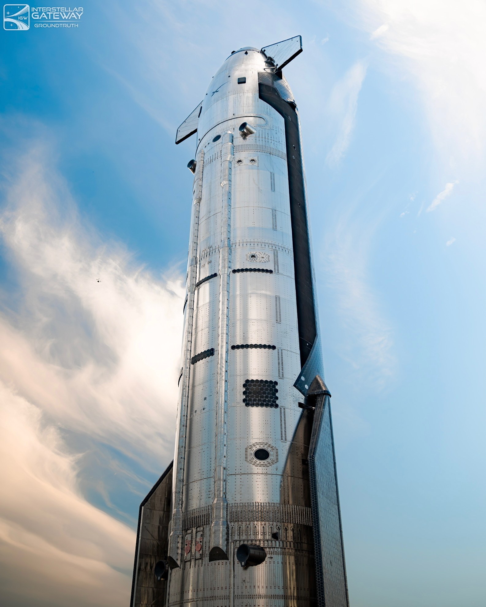 The full Starship stack on the launch mount, looking up from the base.