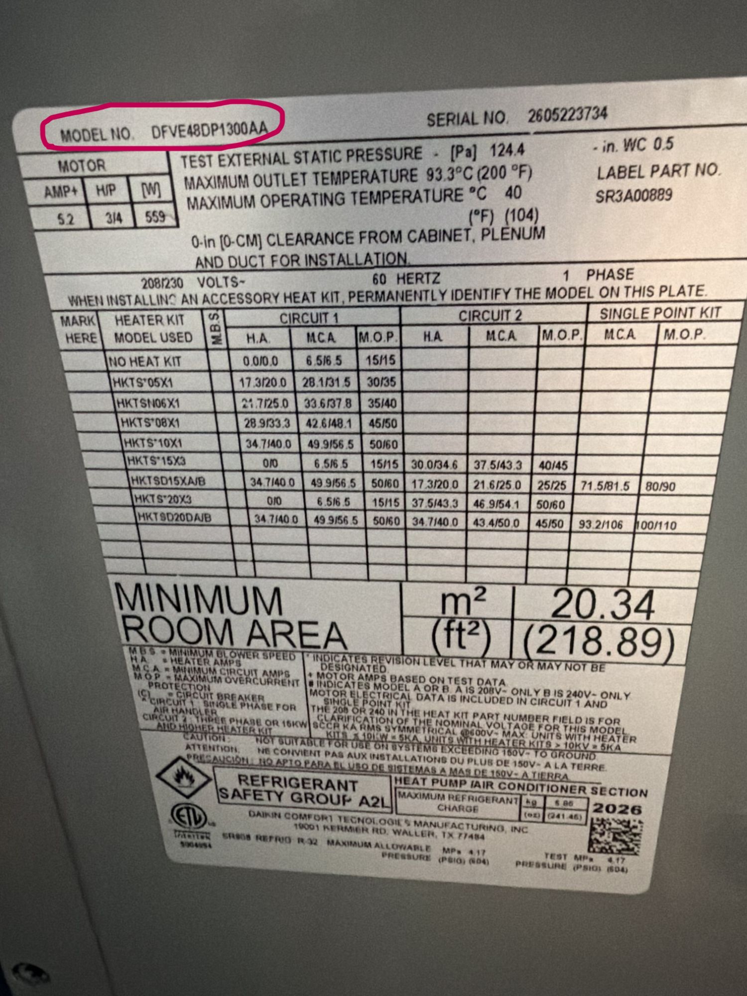 Close-up of a Daikin model and serial plate with the model number highlighted