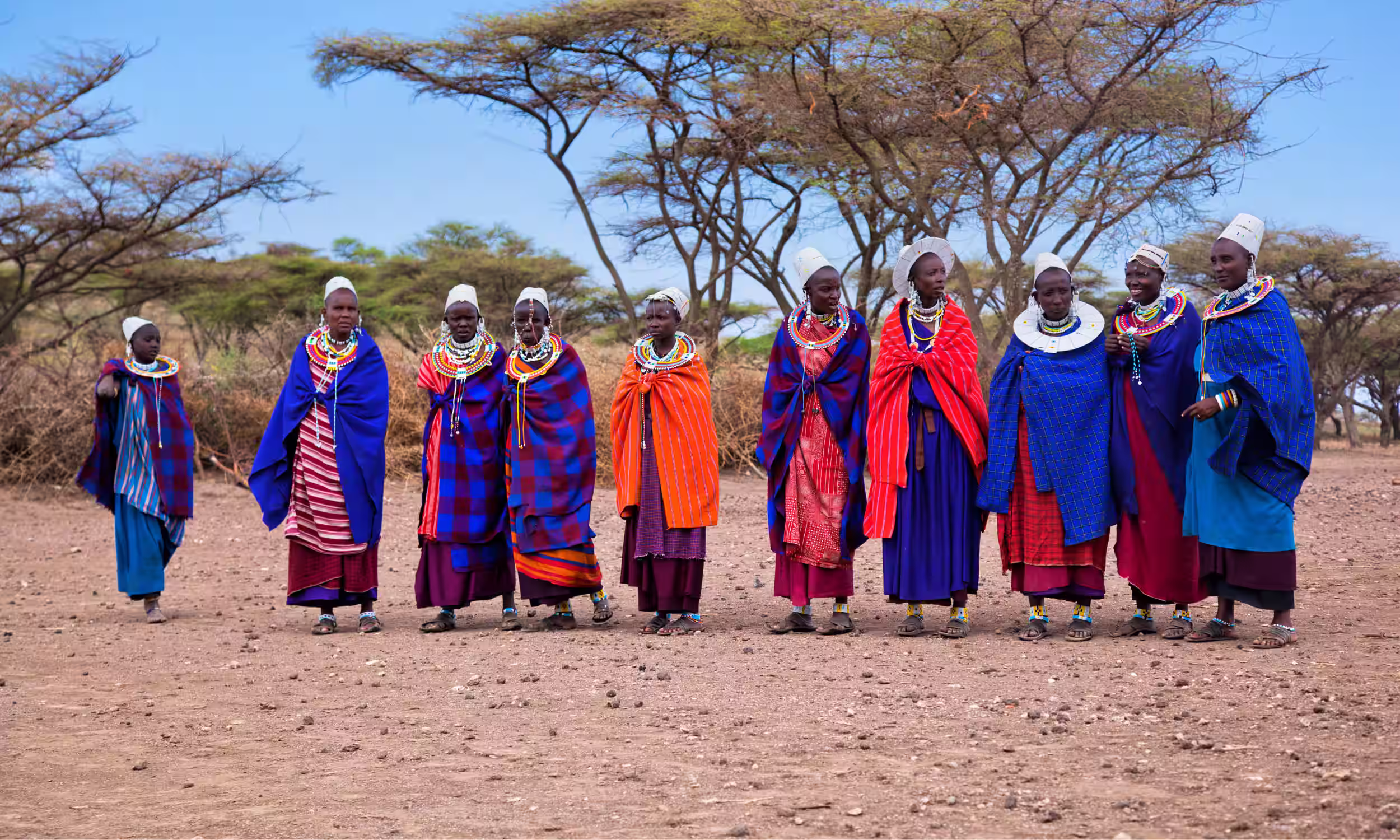Honeymoon couple in Tanzania experiencing Maasai culture.
