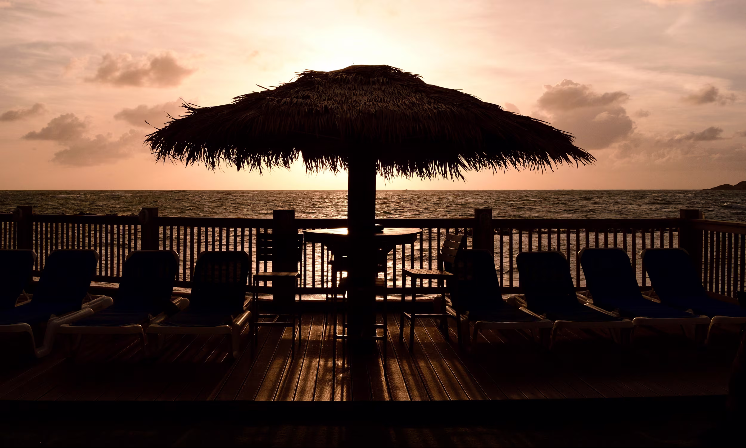 Romantic chairs set on a tropical beach in St. Lucia, perfect for a Caribbean honeymoon.