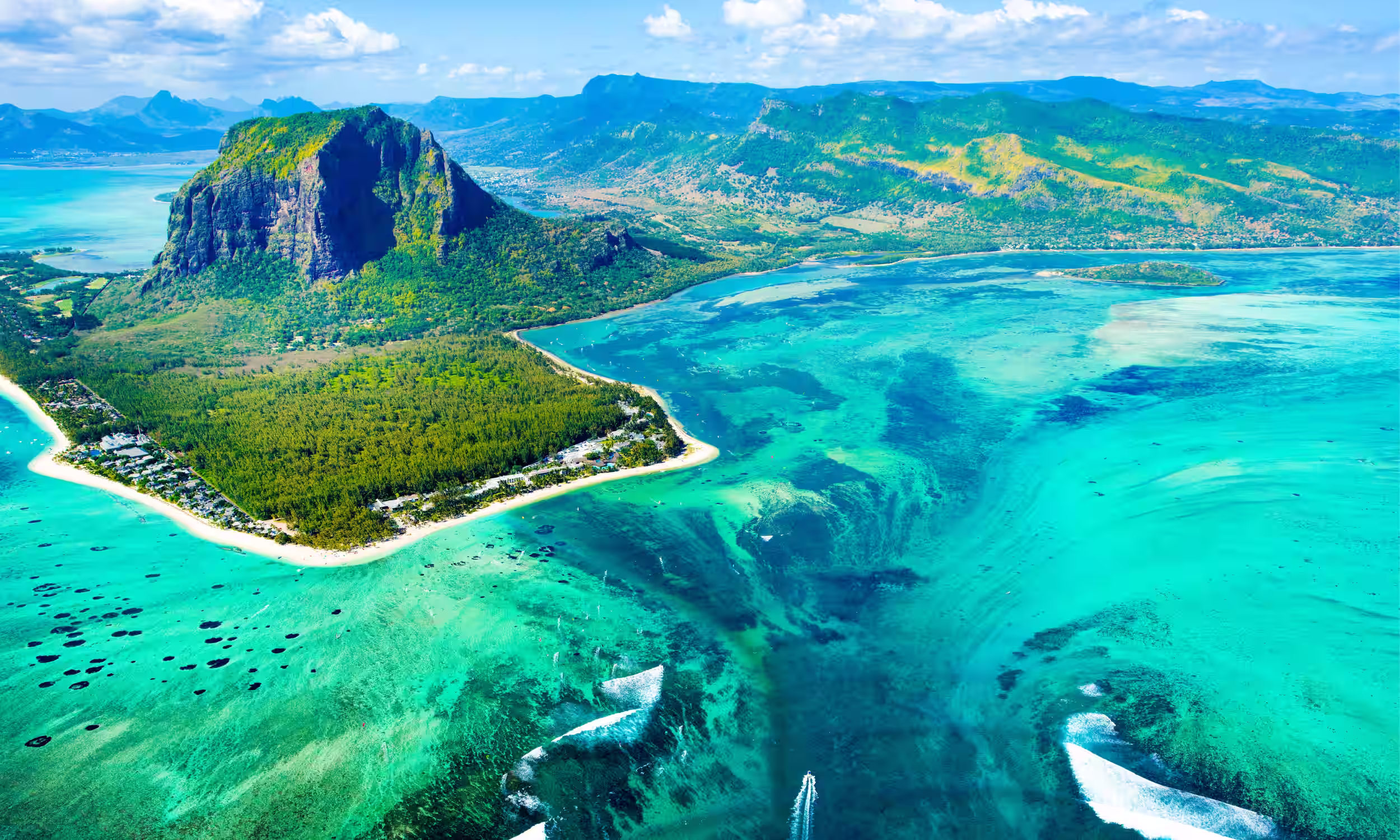 Aerial view of Mauritius turquoise lagoons and white-sand beaches.
