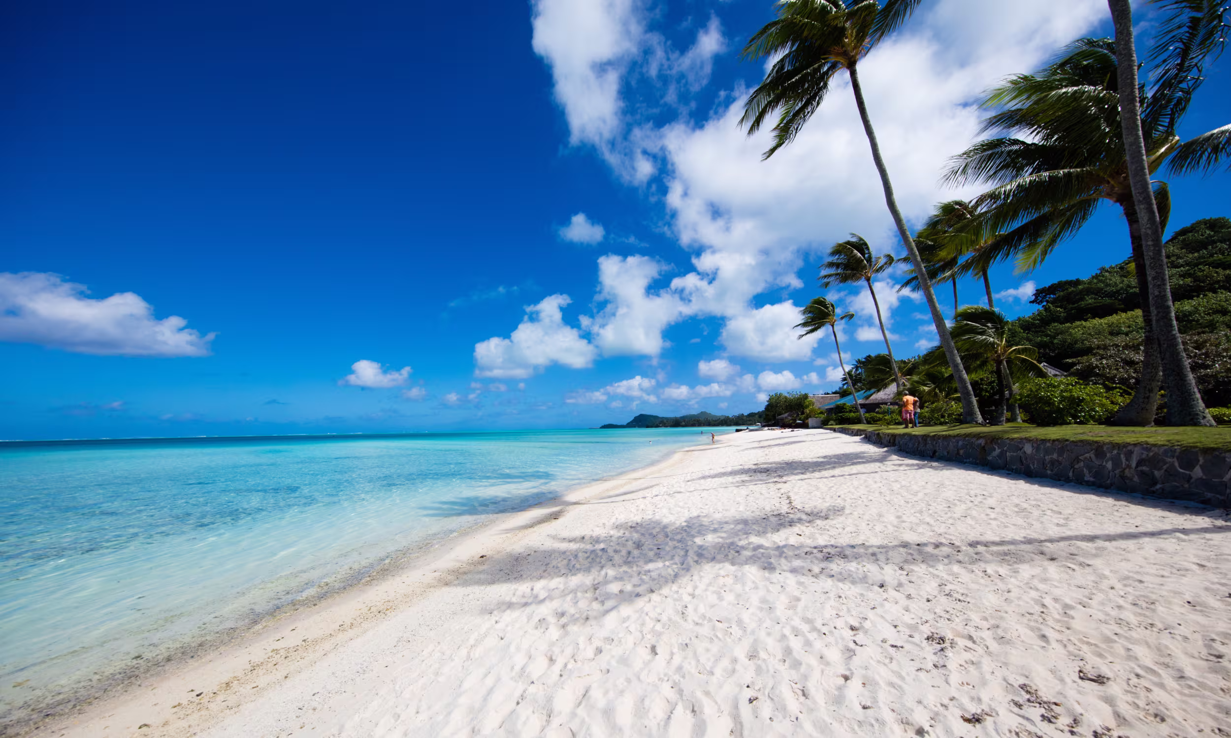 Matira Beach in Bora Bora with white sand and crystal-clear waters.