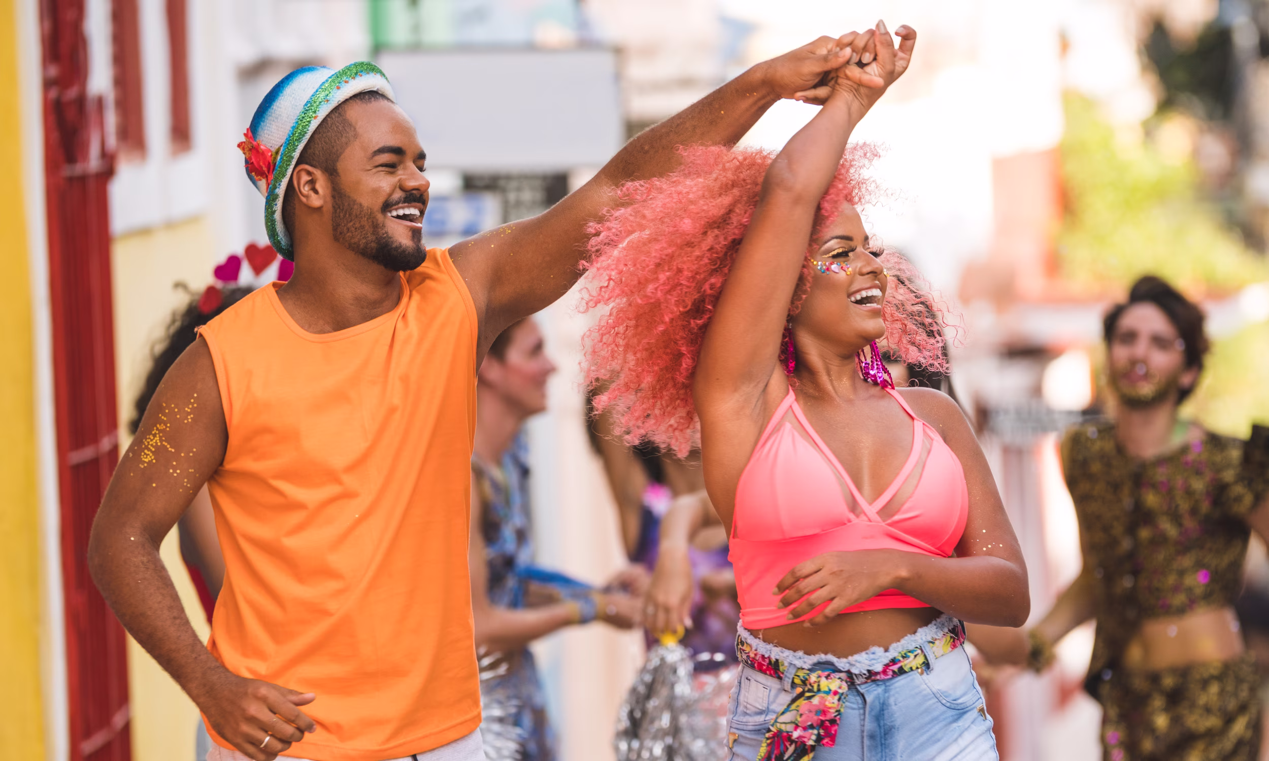 Couple dancing in the colorful streets of Salvador da Bahia to local music. 