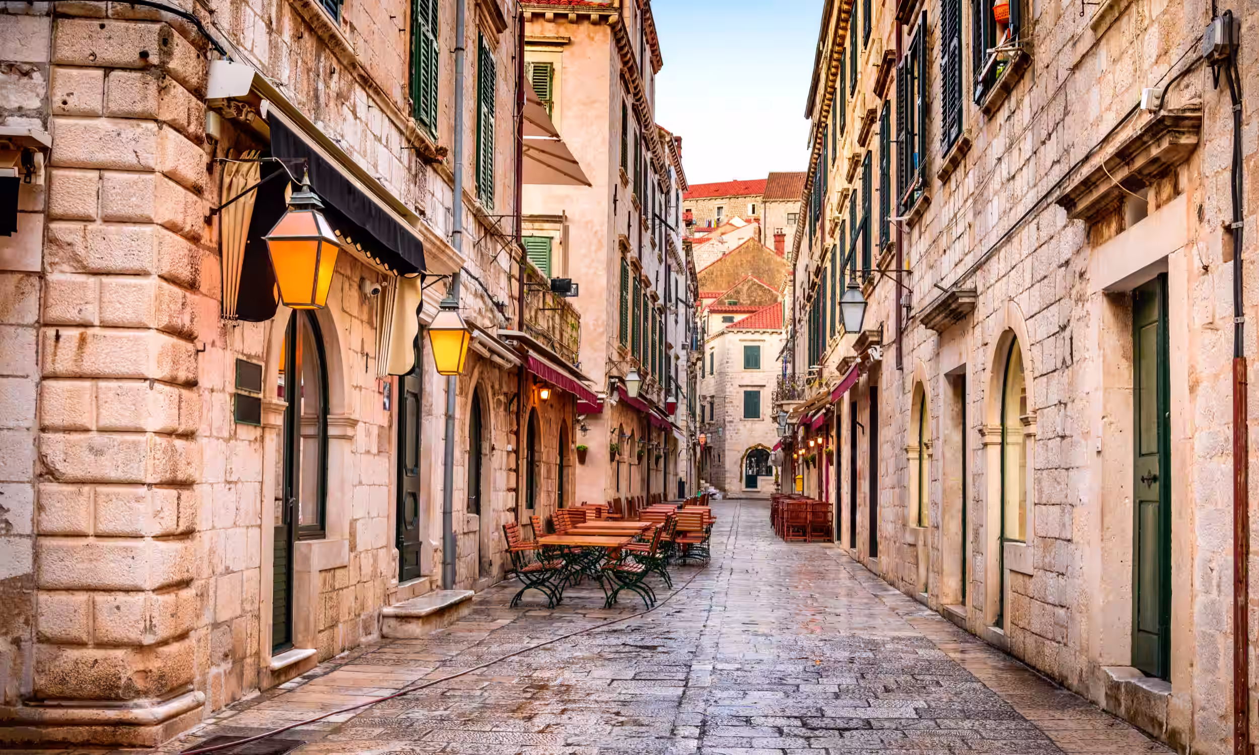 Historic Stradun street in Dubrovnik Old City with illuminated traditional architecture. 