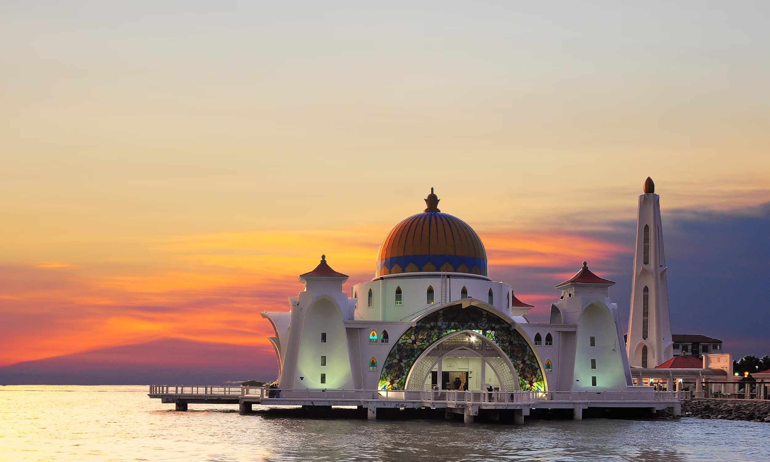 Malacca Straits Mosque at sunset, a romantic honeymoon landmark in Malaysia 