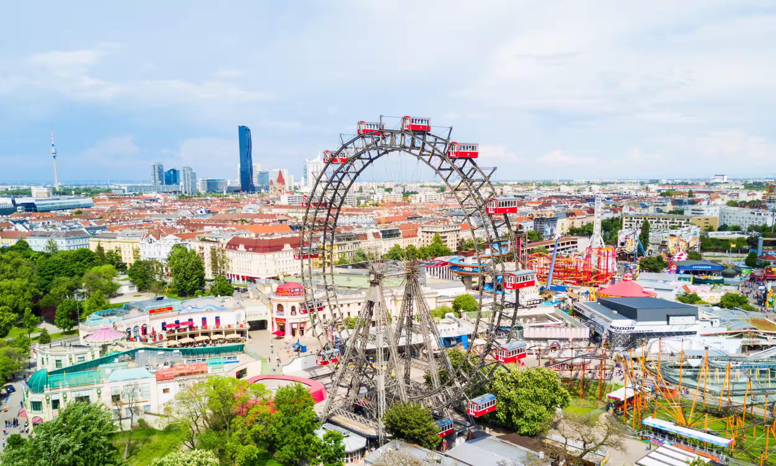 Wurstelprater amusement park in Vienna with the Ferris wheel in the background.