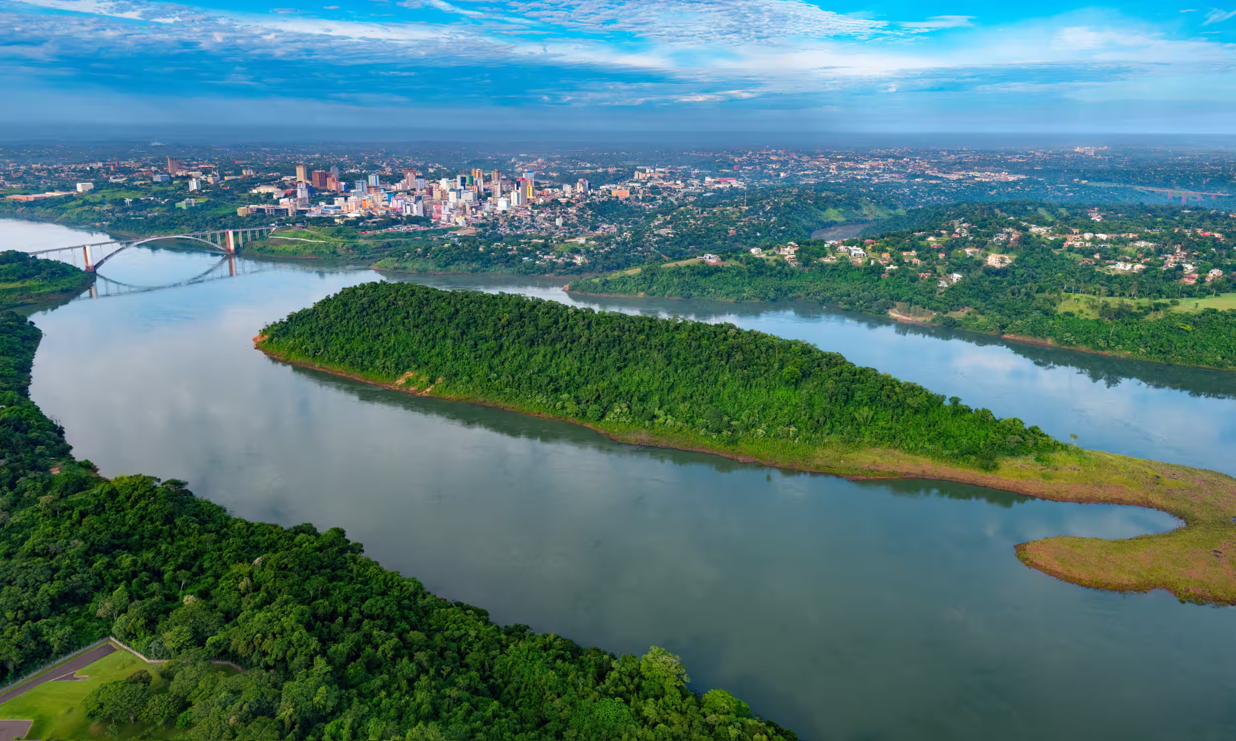 Aerial view of Ciudad del Este and the Friendship Bridge over the Paraná River in Paraguay.