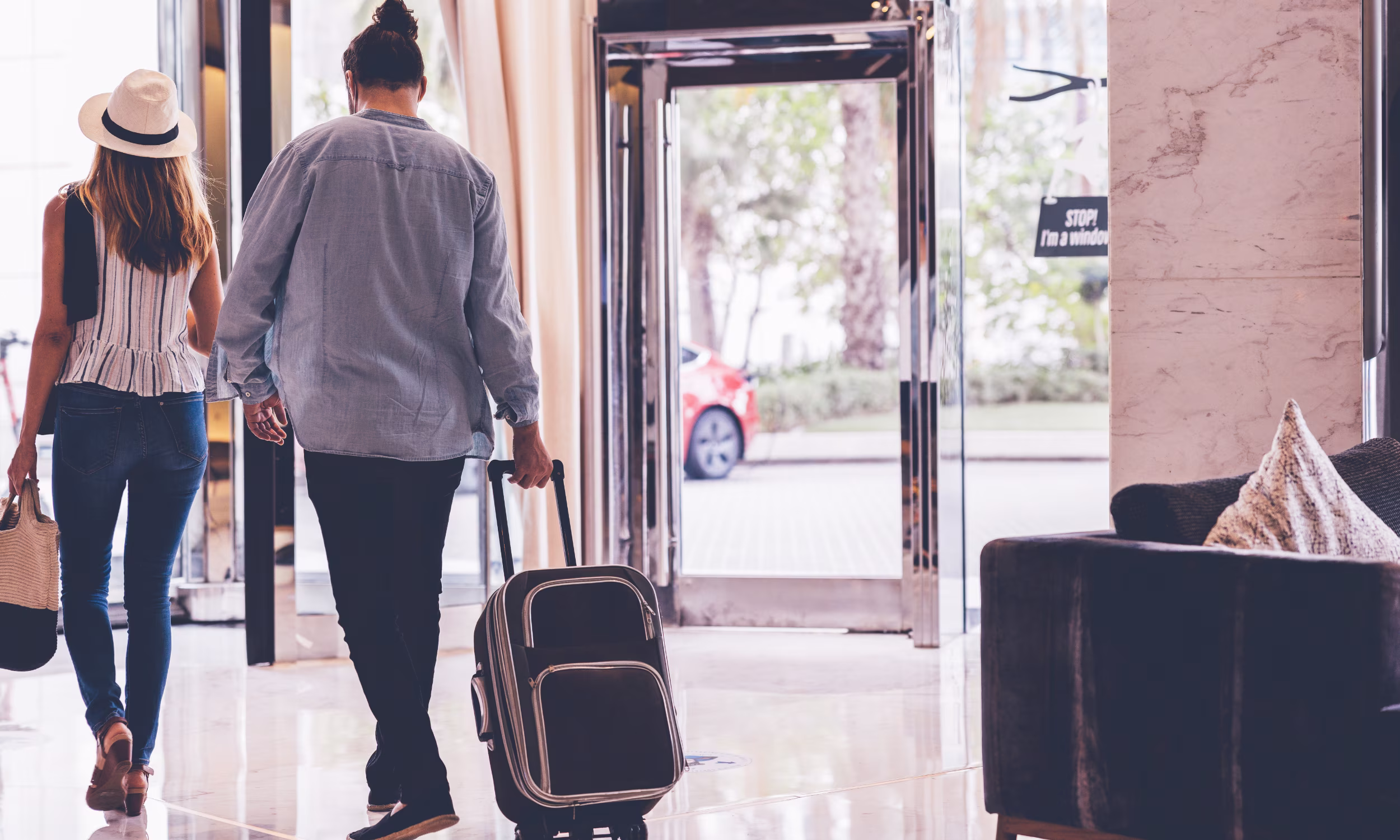 Couple arriving at the hotel at the beginning of their honeymoon