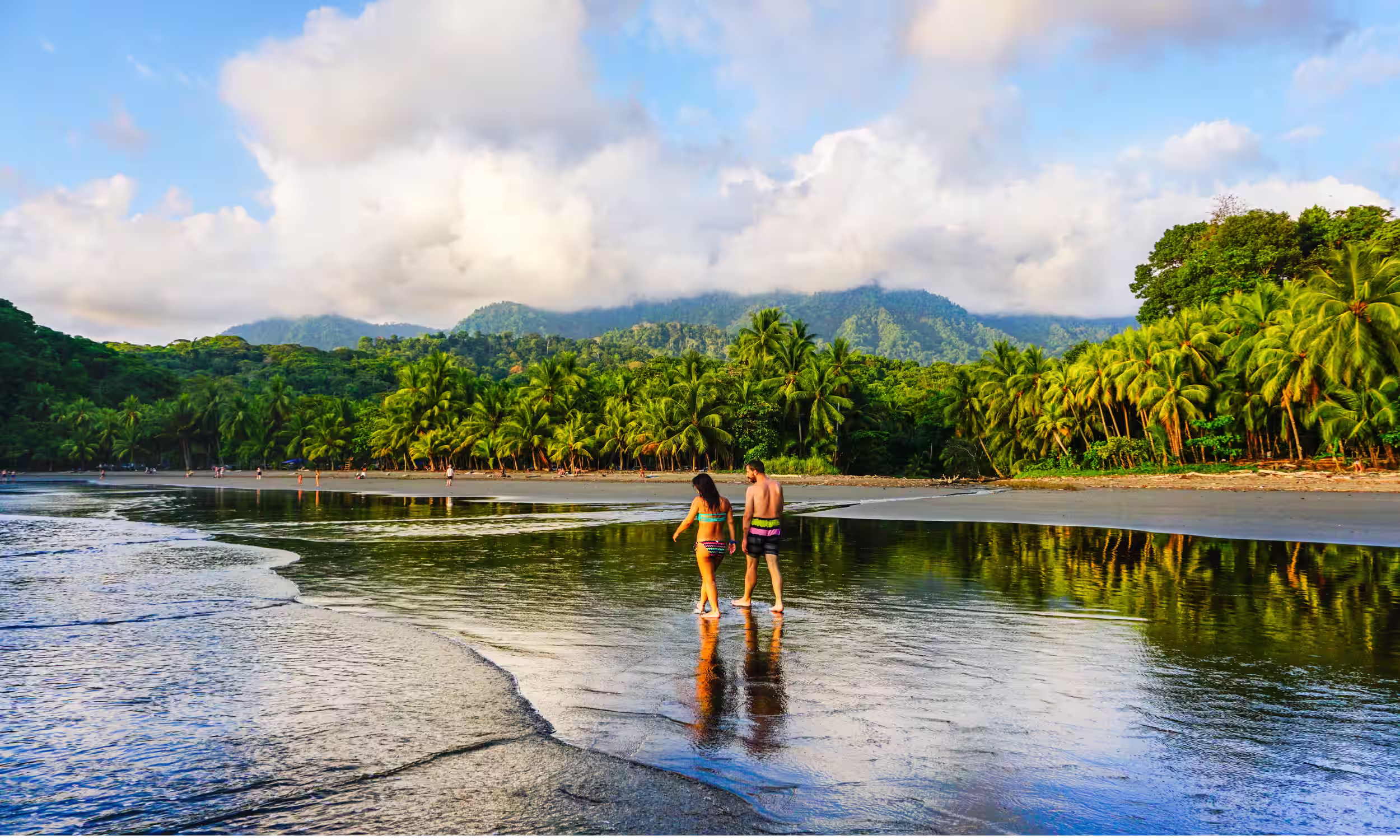 Couple near a jungle waterfall in Costa Rica