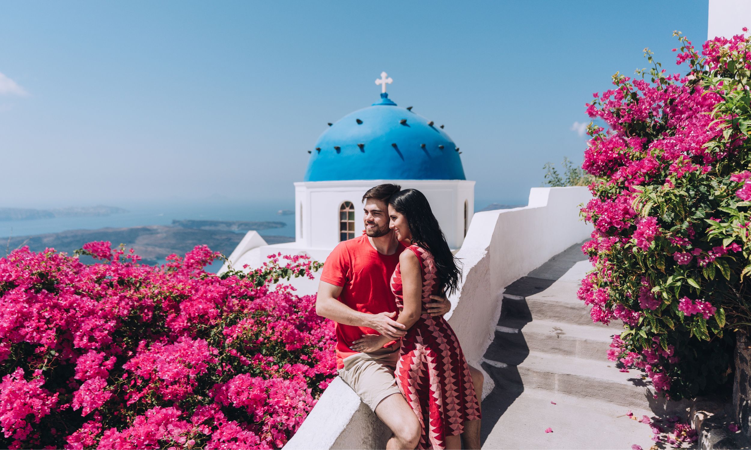 Couple enjoying a romantic honeymoon in Santorini, Greece.