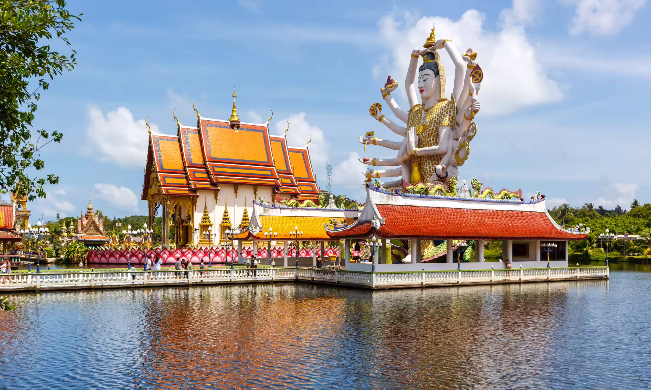 Wat Plai Laem Temple and the large Guanyin statue beside the water in Koh Samui, Thailand.