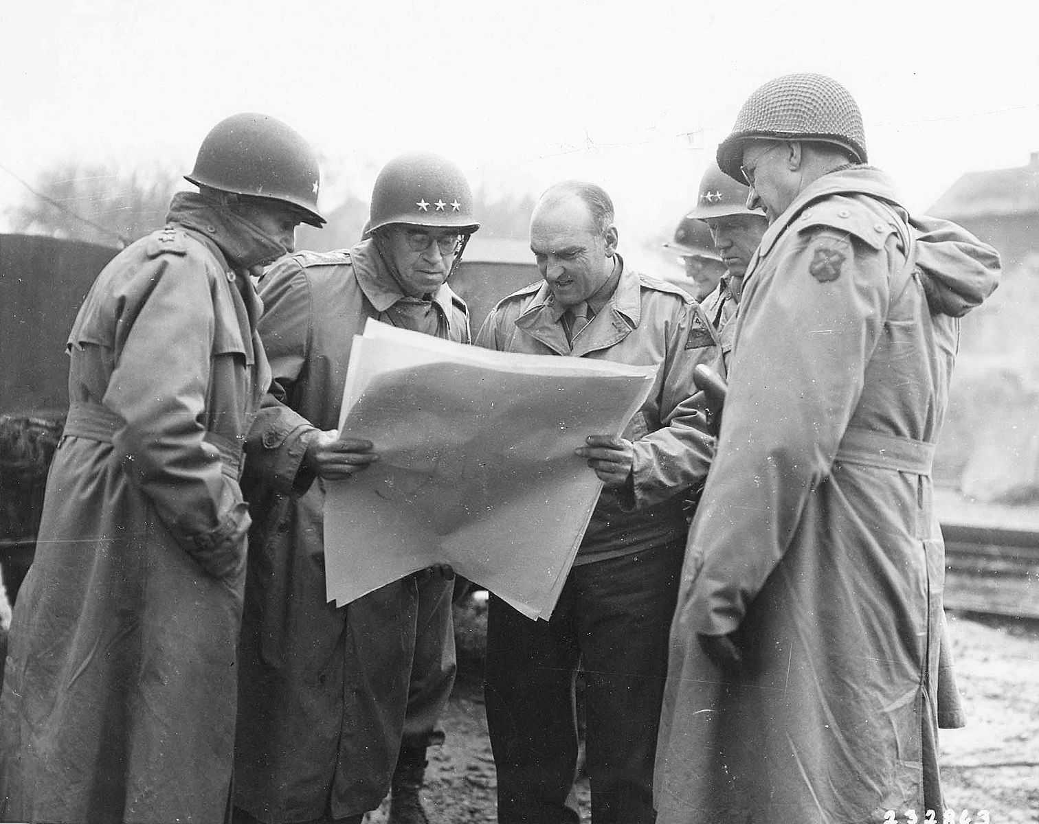 Lieutenant General George Patton inspecting a map near Metz, France during World War 2.