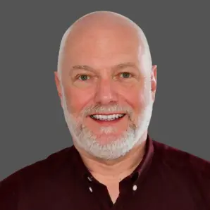 a headshot of Trevor Dearing