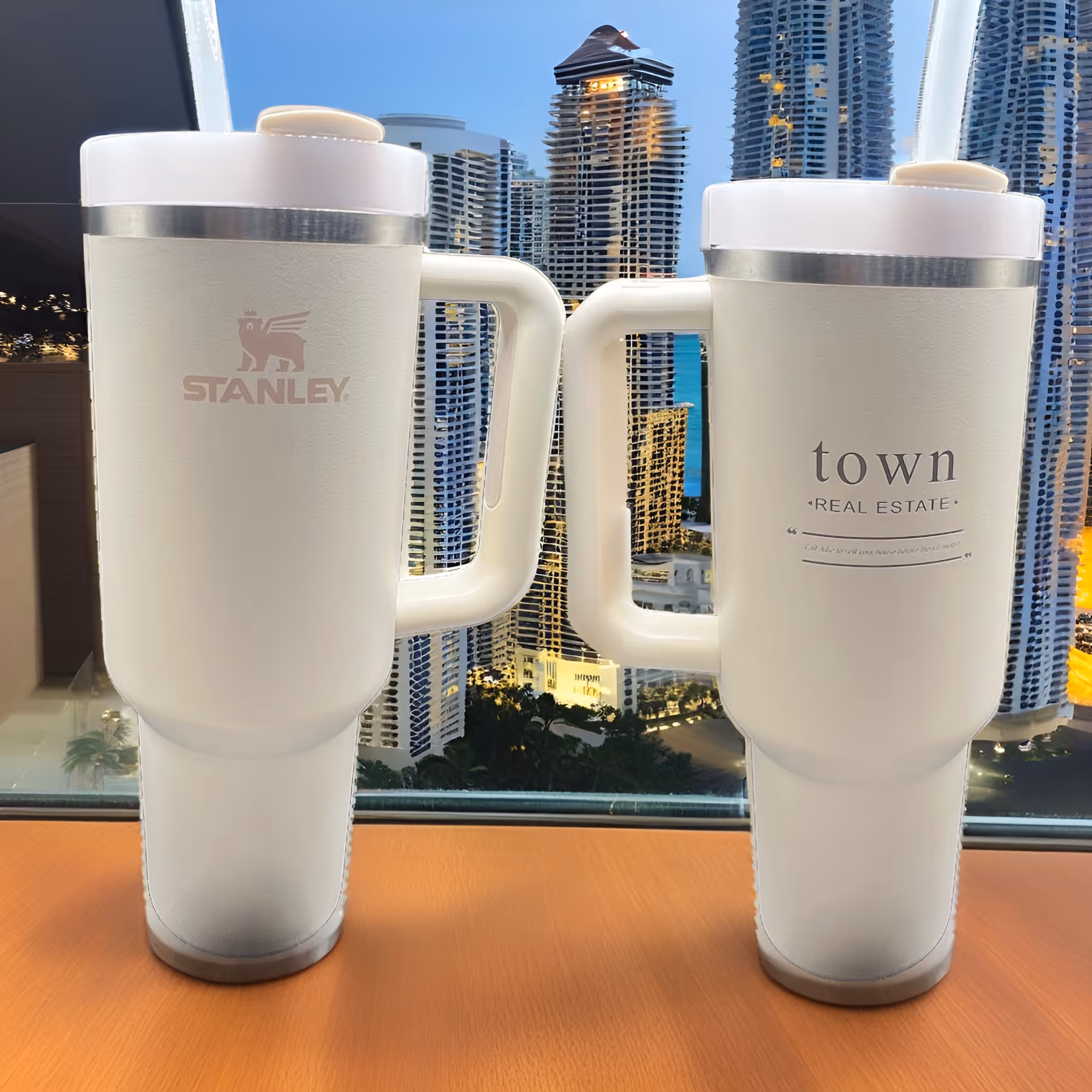 Two white Stannley Town mugs with a city skyline in the background miami fort lauderdale laser engraved