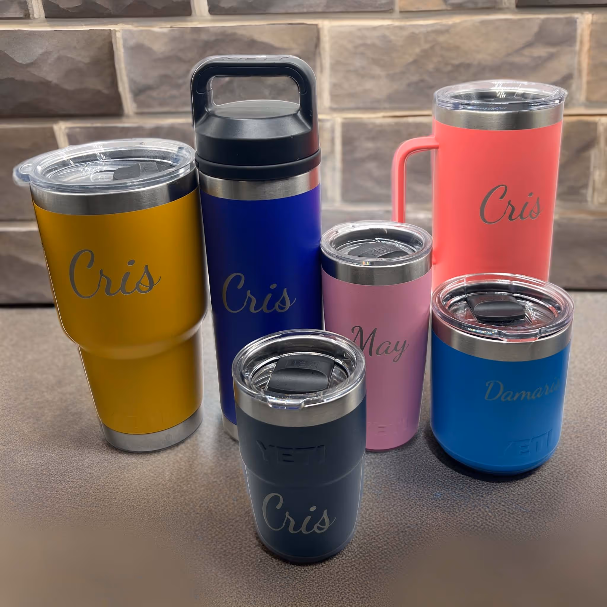 A collection of different colored water bottles with the name Cris on them  miami fort lauderdale 