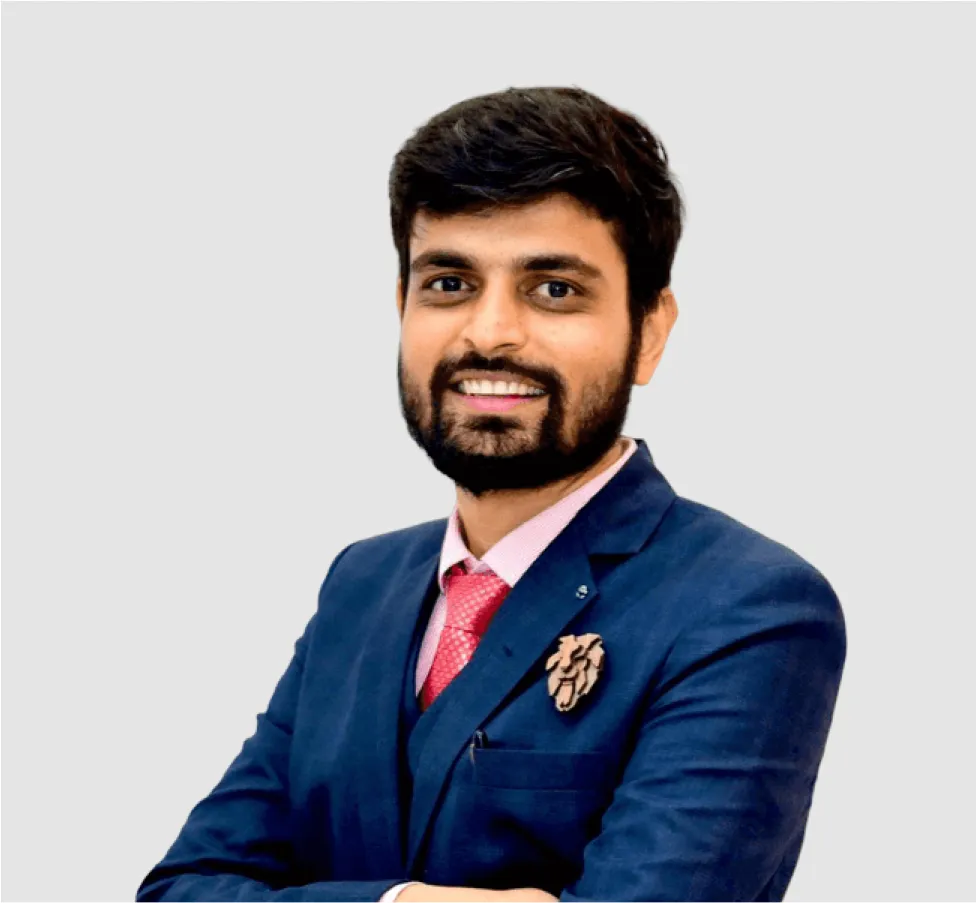 A man in a blue suit and red tie.