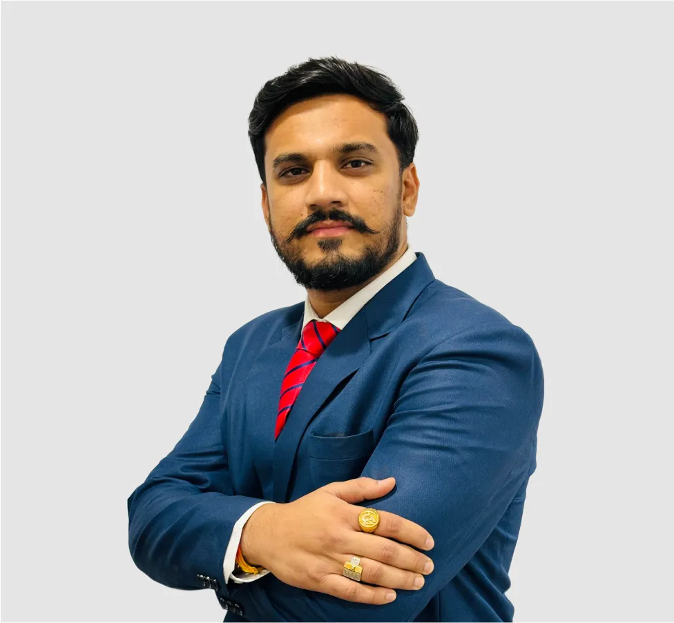 A man in a blue suit and red tie.