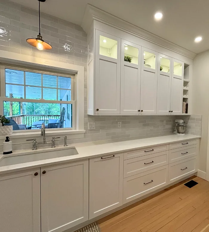 White IKEA kitchen with custom shaker doors and pendant light