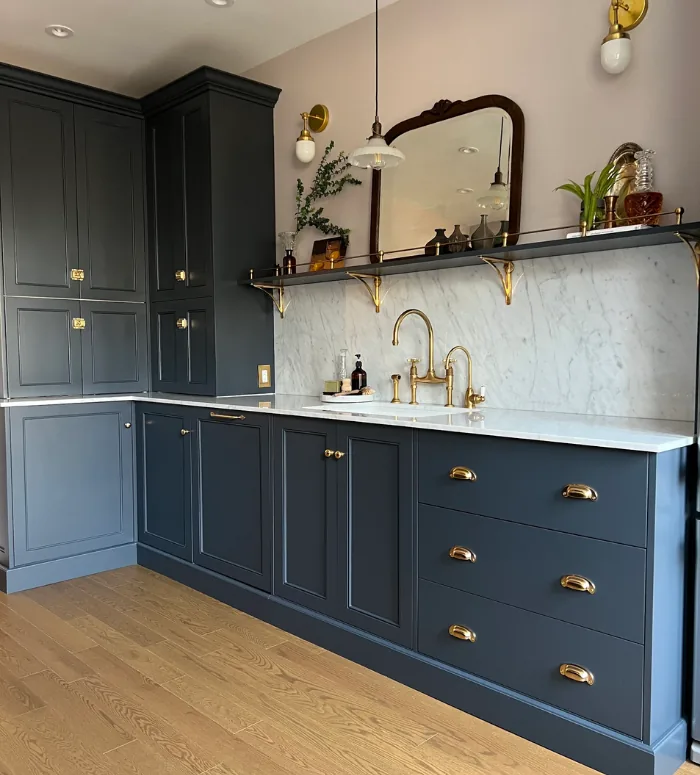 Navy lower cabinets with brass hardware