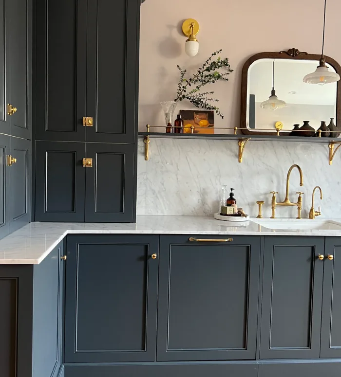 Navy IKEA kitchen with custom doors and arched mirror
