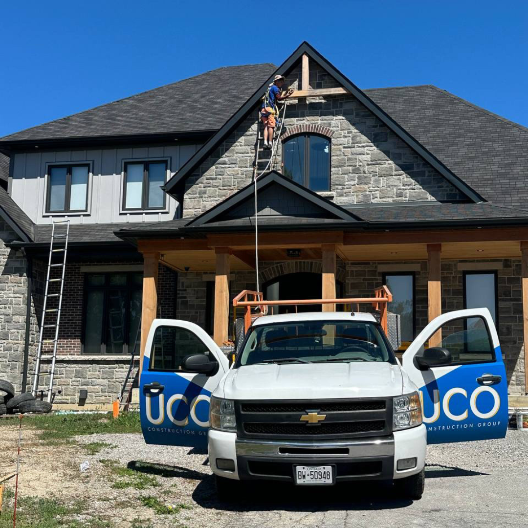 uco construction group truck in front of the wood refinishing project